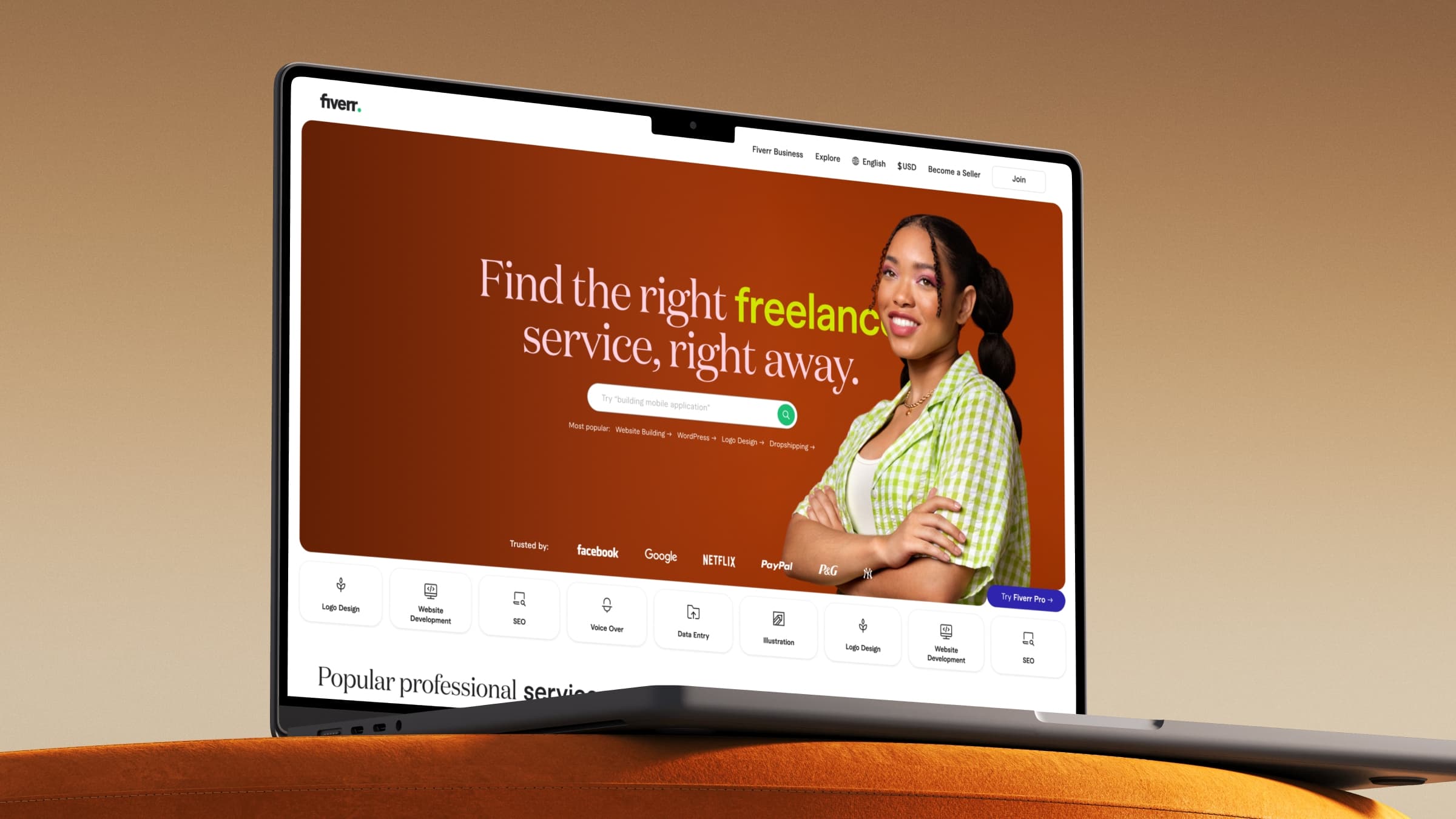 Fiverr homepage hero on laptop with freelancer portrait