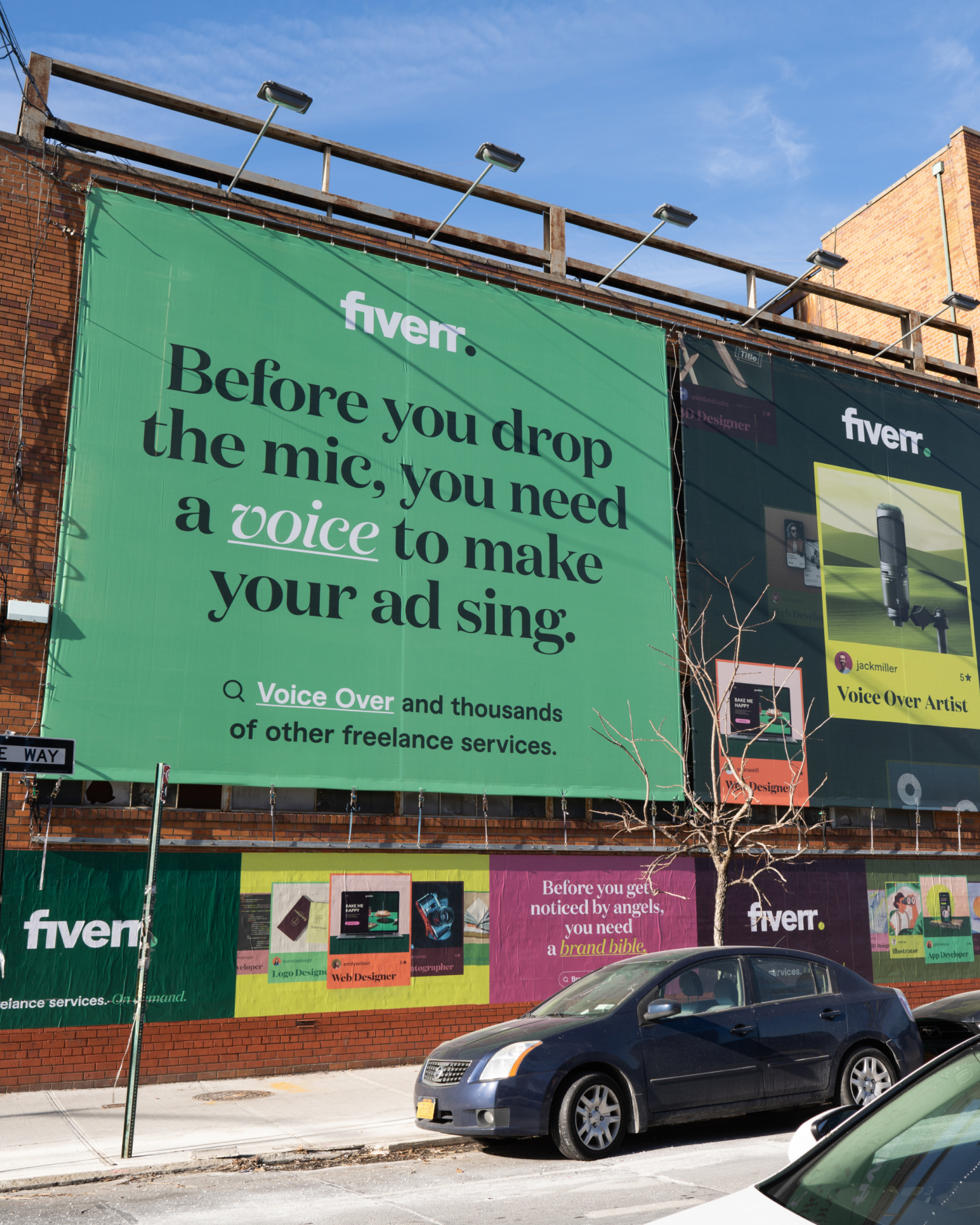 JCDecaux street newsstand: dark green Before you leave your mark… design it, logo design footer, city sidewalk and Raising Cane's in the background